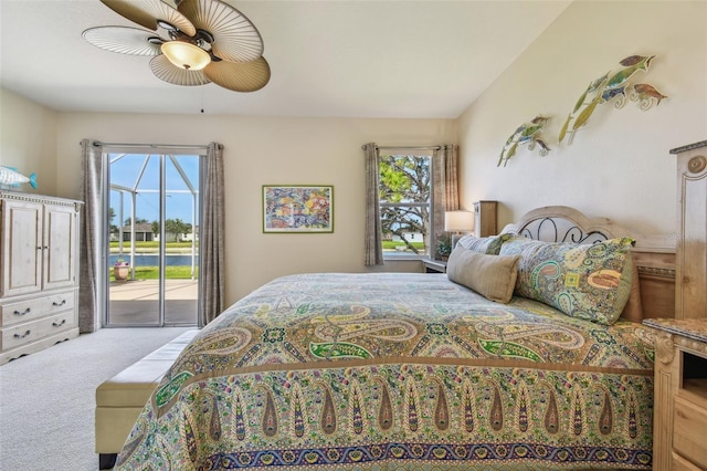 bedroom featuring access to outside, multiple windows, carpet floors, and ceiling fan