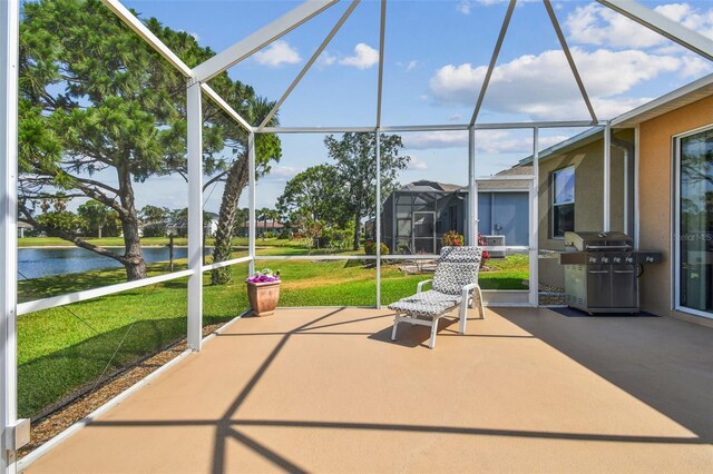 unfurnished sunroom featuring a water view and healthy amount of natural light