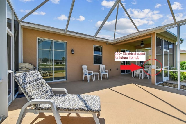 view of patio featuring glass enclosure