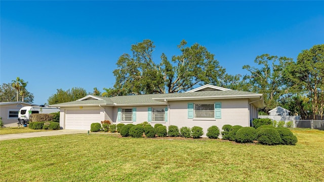 single story home with a garage and driveway