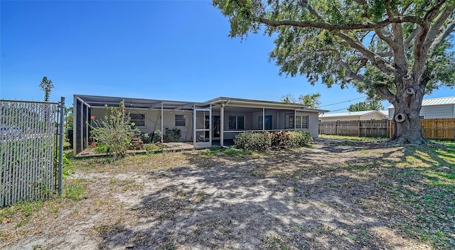 5706 10th Avenue Dr W, Bradenton, FL 34209 - back of property with a sunroom