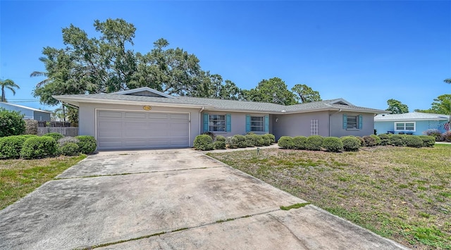5706 10th Avenue Dr W, Bradenton, FL 34209 - ranch-style house with an attached garage, stucco siding, and concrete driveway