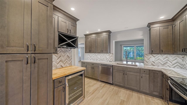 5706 10th Avenue Dr W, Bradenton, FL 34209 - kitchen with stainless steel appliances, beverage cooler, tasteful backsplash, and recessed lighting