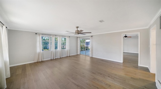 5706 10th Avenue Dr W, Bradenton, FL 34209 - empty room featuring ceiling fan, ornamental molding, wood finished floors, and baseboards