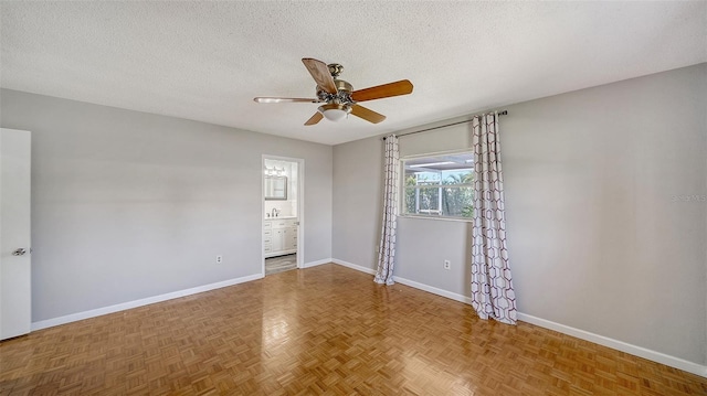 5706 10th Avenue Dr W, Bradenton, FL 34209 - unfurnished room with baseboards, ceiling fan, and a textured ceiling
