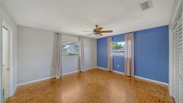 5706 10th Avenue Dr W, Bradenton, FL 34209 - spare room with ceiling fan, a textured ceiling, and baseboards