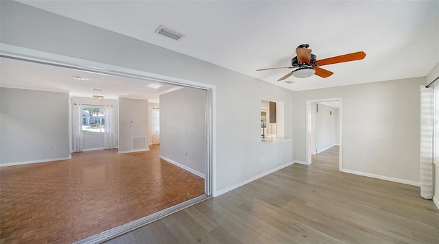 5706 10th Avenue Dr W, Bradenton, FL 34209 - unfurnished room featuring baseboards, a ceiling fan, and wood finished floors