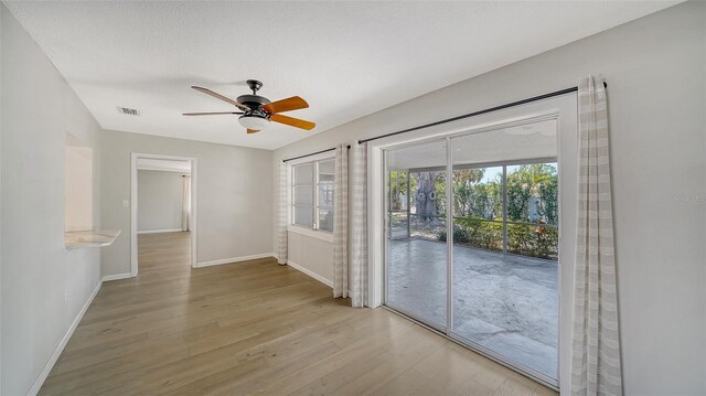 5706 10th Avenue Dr W, Bradenton, FL 34209 - spare room with light wood-style flooring, baseboards, and a ceiling fan