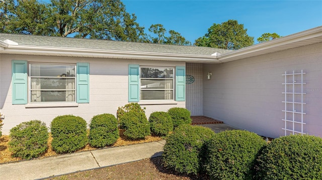 5706 10th Avenue Dr W, Bradenton, FL 34209 - view of exterior entry with roof with shingles