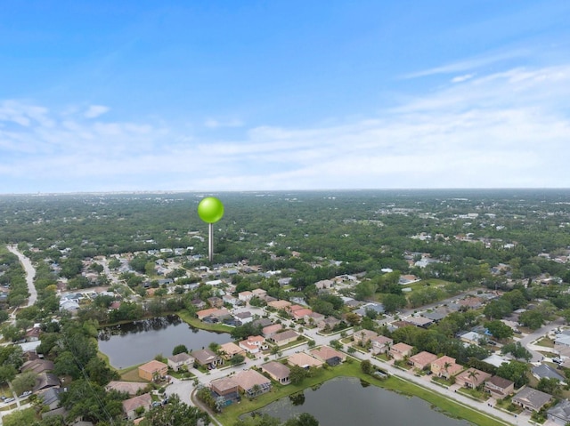aerial overview of property's location with nearby suburban area and a large body of water