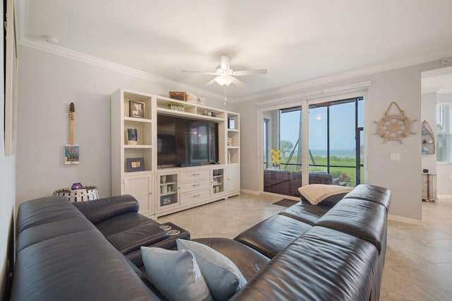 910 Tidewater Shores Loop Unit 103, Bradenton, FL 34208 - living area with a ceiling fan, crown molding, plenty of natural light, baseboards, and light tile patterned floors
