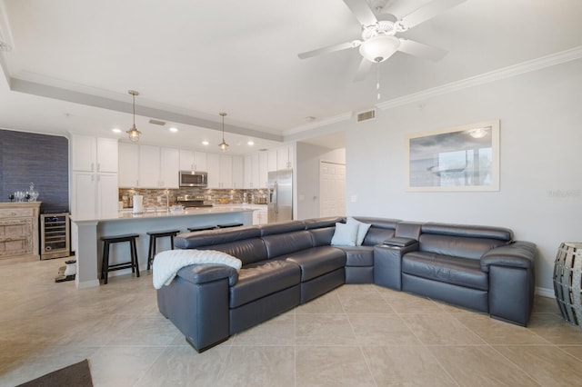 910 Tidewater Shores Loop Unit 103, Bradenton, FL 34208 - living room featuring ornamental molding, wine cooler, light tile patterned flooring, ceiling fan, and recessed lighting