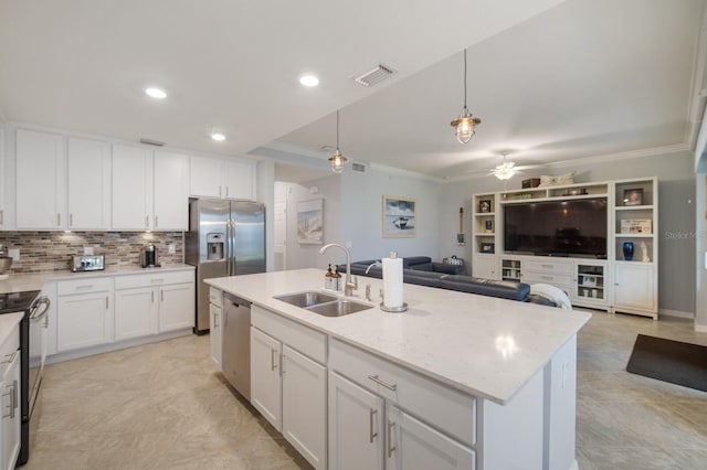 910 Tidewater Shores Loop Unit 103, Bradenton, FL 34208 - kitchen with a sink, appliances with stainless steel finishes, open floor plan, crown molding, and ceiling fan