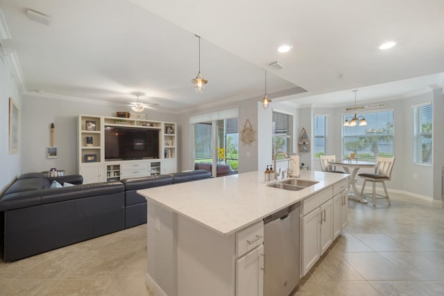 910 Tidewater Shores Loop Unit 103, Bradenton, FL 34208 - kitchen featuring dishwasher, a sink, ornamental molding, white cabinets, and an island with sink