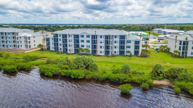 910 Tidewater Shores Loop Unit 103, Bradenton, FL 34208 - drone / aerial view of a large body of water and apartment complex