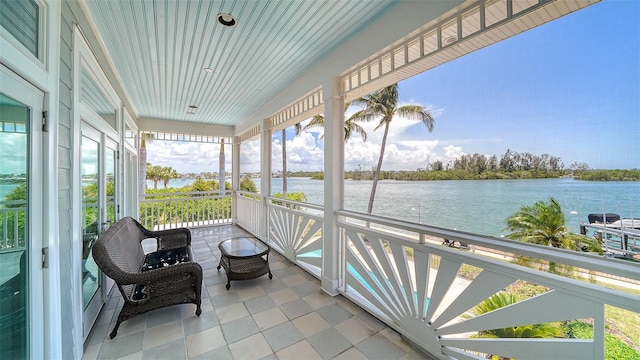 878 Freeling Dr, Sarasota, FL 34242 - sunroom / solarium featuring a water view
