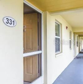entrance to property with stucco siding