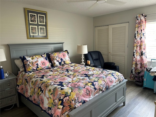 bedroom featuring wood finished floors, a closet, and ceiling fan