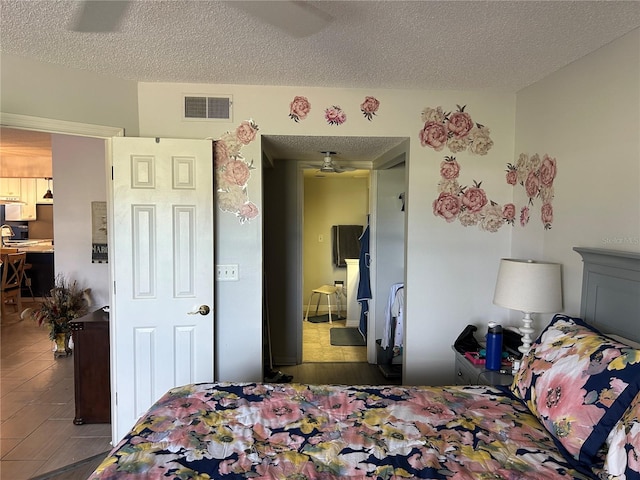 bedroom featuring a textured ceiling
