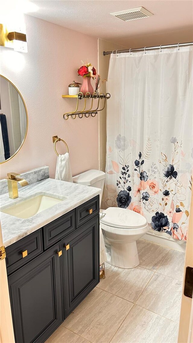 433 Cerromar Ln Unit 331, Venice, FL 34293 - bathroom with vanity, toilet, and a shower with curtain