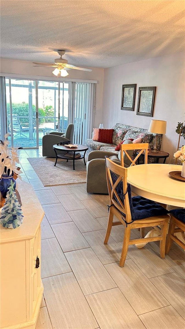 433 Cerromar Ln Unit 331, Venice, FL 34293 - living room featuring a textured ceiling and a ceiling fan