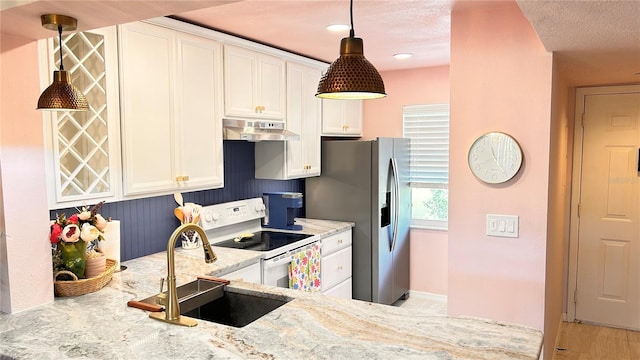 433 Cerromar Ln Unit 331, Venice, FL 34293 - kitchen featuring under cabinet range hood, white electric stove, a sink, stainless steel refrigerator with ice dispenser, and white cabinets