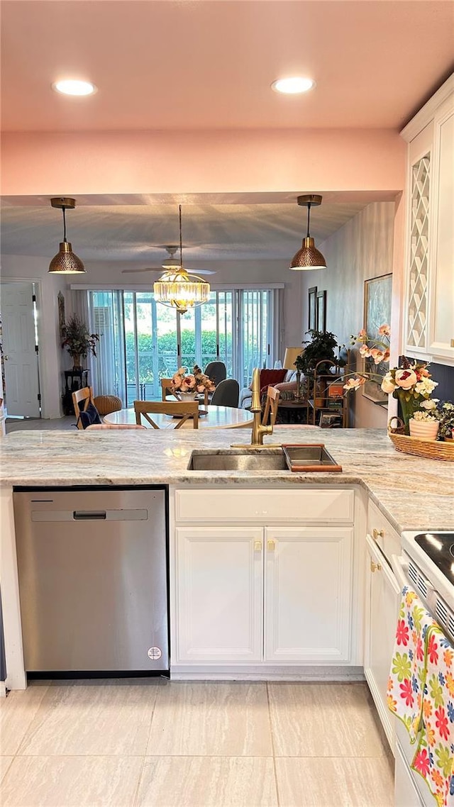 433 Cerromar Ln Unit 331, Venice, FL 34293 - kitchen featuring dishwasher, a sink, white electric range oven, white cabinets, and light stone countertops