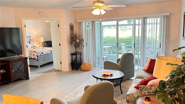 433 Cerromar Ln Unit 331, Venice, FL 34293 - living room with ceiling fan, plenty of natural light, and a textured ceiling