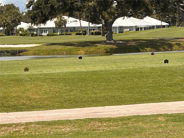 433 Cerromar Ln Unit 331, Venice, FL 34293 - surrounding community with a water view, a yard, and view of golf course