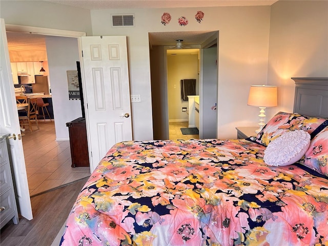 433 Cerromar Ln Unit 331, Venice, FL 34293 - bedroom featuring wood finished floors