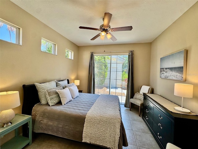 bedroom with access to outside, light tile patterned flooring, and ceiling fan