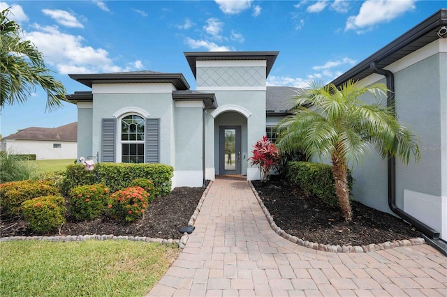 doorway to property with stucco siding