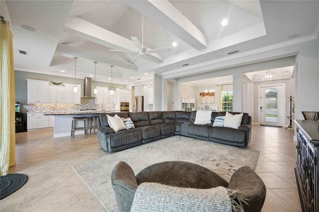 living area with a chandelier, light tile patterned floors, a ceiling fan, recessed lighting, and crown molding