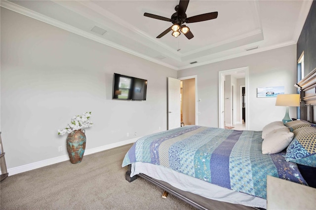 bedroom with a raised ceiling, carpet flooring, ornamental molding, ceiling fan, and baseboards