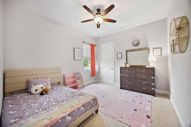 carpeted bedroom with baseboards and ceiling fan