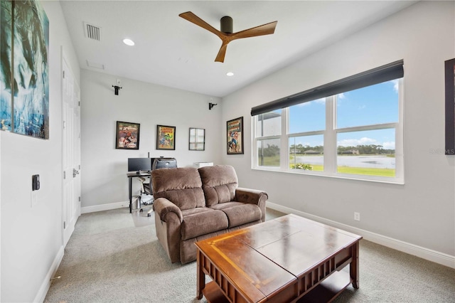 living room featuring a ceiling fan, an office area, light colored carpet, baseboards, and recessed lighting