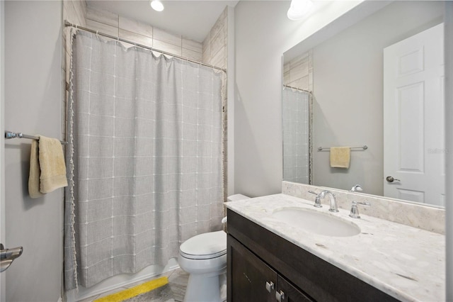 full bathroom featuring toilet and vanity