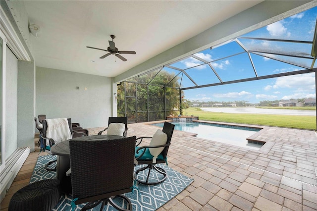 view of patio / terrace featuring a water view, an outdoor pool, ceiling fan, and glass enclosure