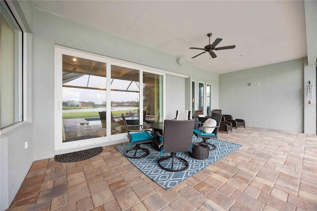 view of patio with a ceiling fan and outdoor dining space