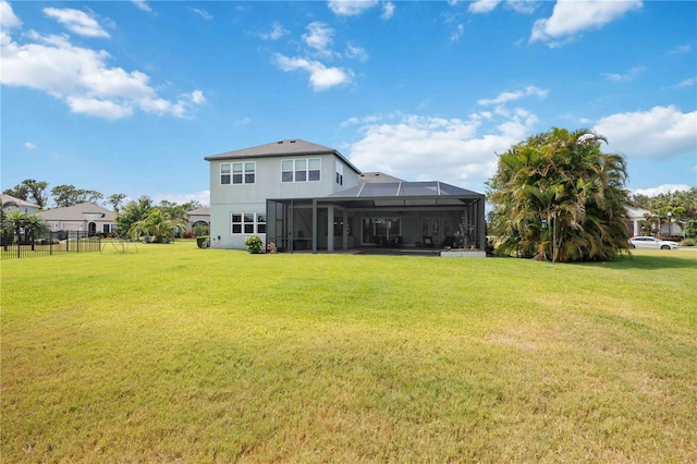 rear view of property featuring stucco siding and a lanai