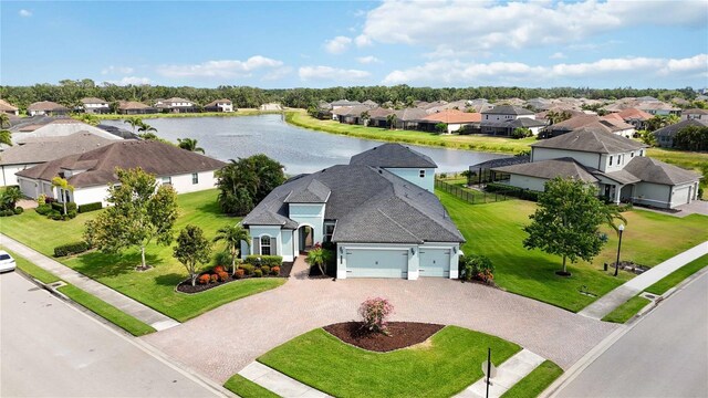 aerial perspective of suburban area with a large body of water