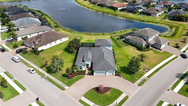 aerial view of residential area with a large body of water