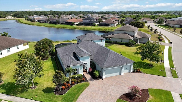 aerial view of residential area featuring a nearby body of water