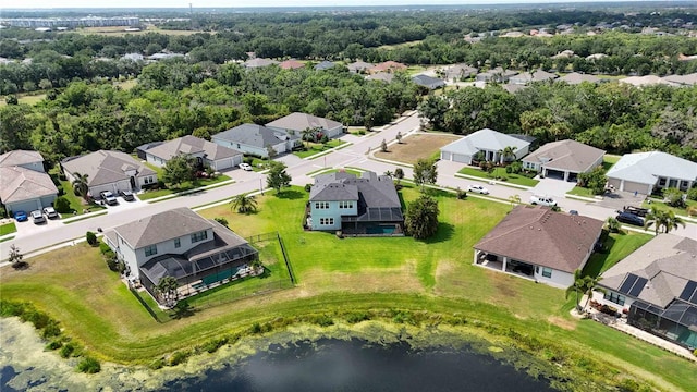 aerial perspective of suburban area with a nearby body of water