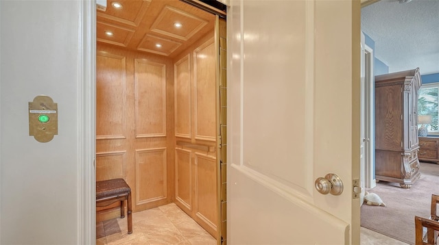 elevator with a decorative wall and recessed lighting