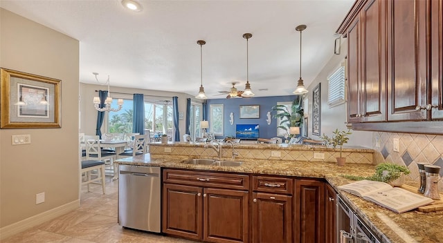 kitchen featuring dishwasher, a peninsula, backsplash, a sink, and ceiling fan