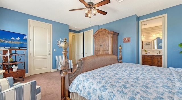 bedroom featuring carpet flooring, baseboards, a ceiling fan, and connected bathroom