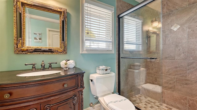 full bathroom with a shower stall, toilet, and vanity