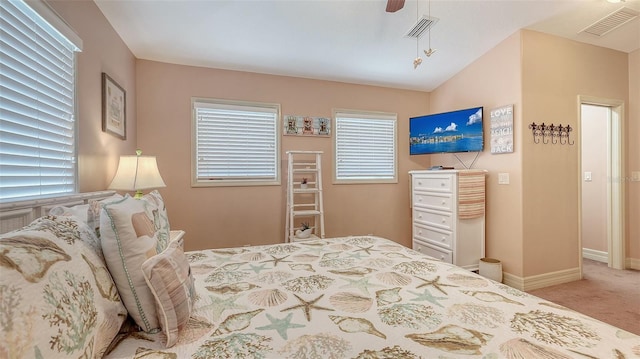 carpeted bedroom featuring baseboards and ceiling fan