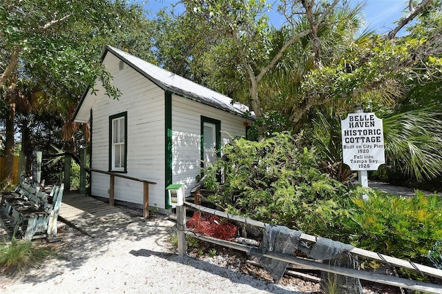 view of home's exterior featuring an outdoor structure